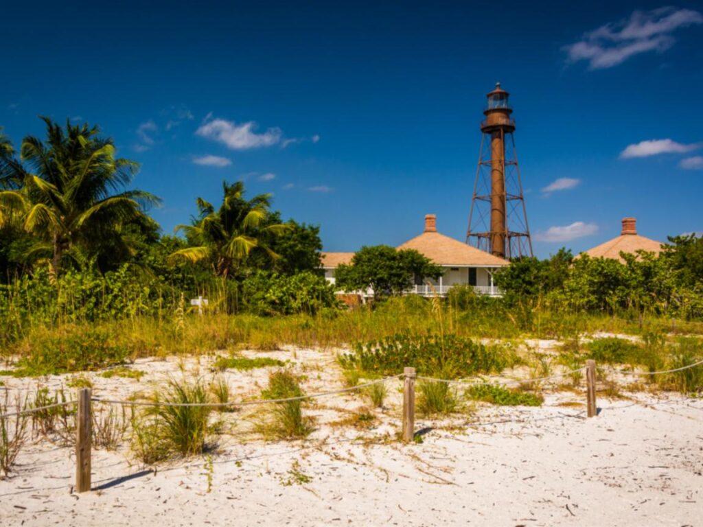 13 Romantic Beaches in Florida Offer the Perfect Couple's Getaway 9 View of the Sanibel lighthouse from the beach