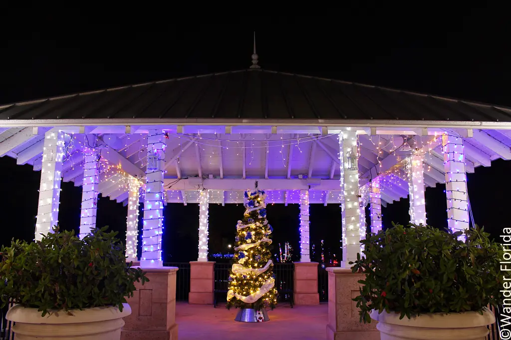 Florida Botanical Gardens - A Beautiful Hidden Gem in Largo 57 A gazebo with a white ceiling and brick floor is decorated with white lights hanging from the the eaves all the way around and twisting around the columns with a lighted Christmas tree standing in the middle of the gazebo.