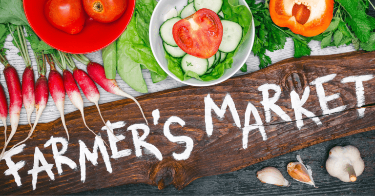 Top 10 Best Farmers' Markets in Tampa 2 Produce and a sign that reads "Farmer's Market"